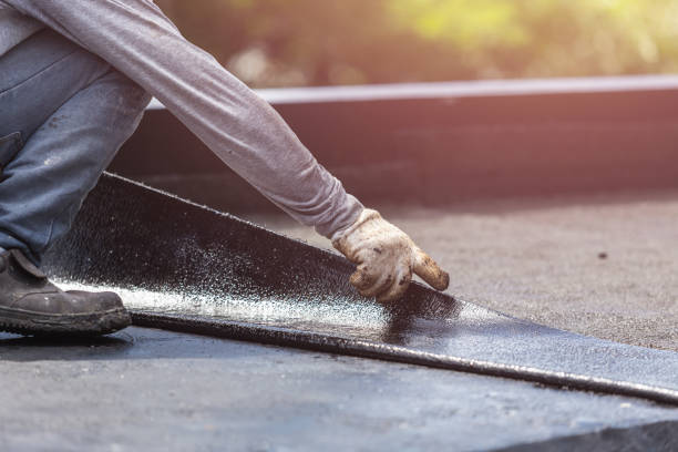 Professional Basement Waterproofing technician working in Woodlawn, MD